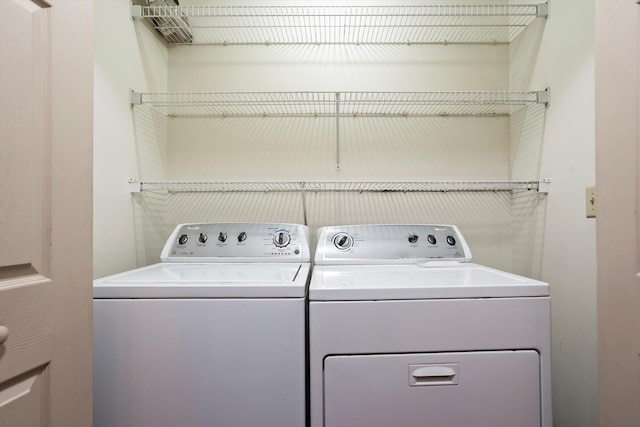 clothes washing area featuring washer and dryer