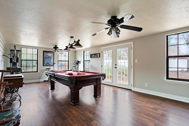 rec room featuring french doors, dark wood-type flooring, plenty of natural light, and pool table