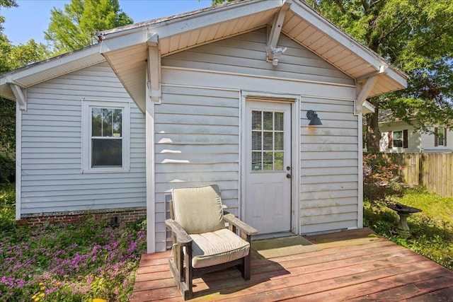 view of outbuilding with fence