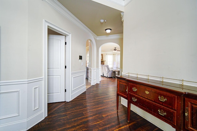 hall with ornamental molding and dark hardwood / wood-style floors