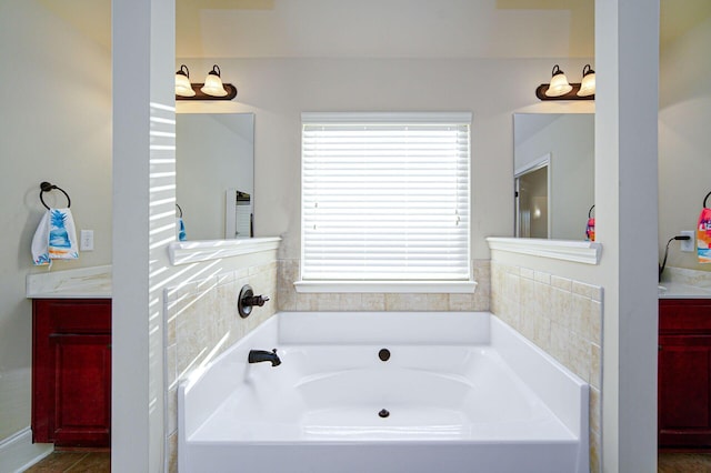 bathroom featuring vanity and a bathtub