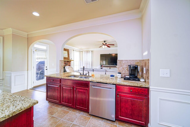 kitchen featuring sink, crown molding, dishwasher, and light stone counters