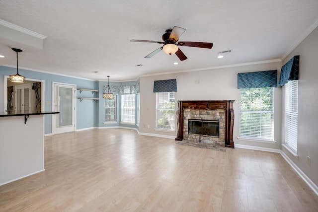 4610 Mulberry Creek Dr, Evans, GA 30809 - unfurnished living room featuring a fireplace, ceiling fan, light wood-type flooring, ornamental molding, and recessed lighting