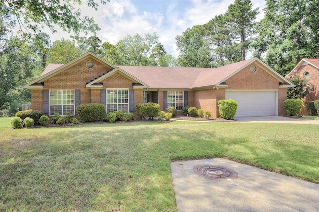 4610 Mulberry Creek Dr, Evans, GA 30809 - ranch-style house with brick siding, a garage, a front lawn, and an outdoor fire pit