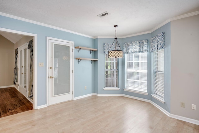 4610 Mulberry Creek Dr, Evans, GA 30809 - unfurnished dining area with light wood-style floors and crown molding