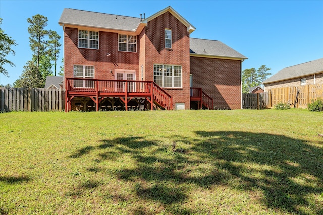 4942 Marble Dr, Evans, GA 30809 - back of house with a lawn, a deck, brick siding, a fenced backyard, and stairs