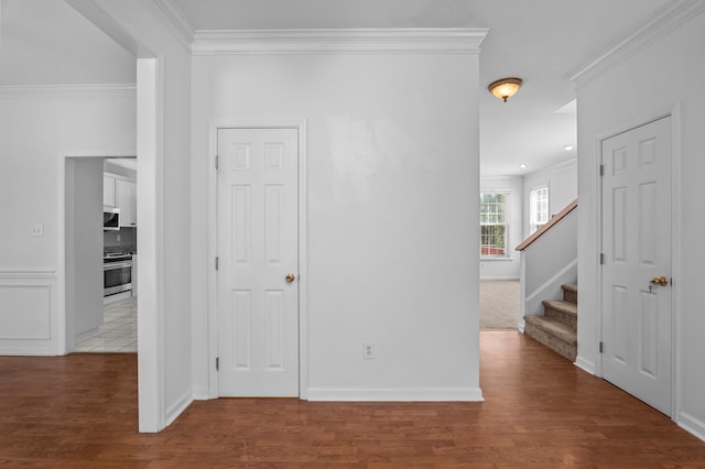 4942 Marble Dr, Evans, GA 30809 - interior space with crown molding, baseboards, wood finished floors, and stairway