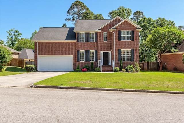 4942 Marble Dr, Evans, GA 30809 - colonial house featuring brick siding, a front lawn, fence, and concrete driveway