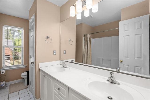 4942 Marble Dr, Evans, GA 30809 - full bathroom with double vanity, a sink, tile patterned floors, and toilet
