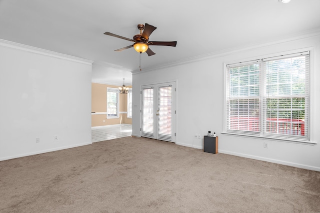 4942 Marble Dr, Evans, GA 30809 - carpeted spare room featuring crown molding, baseboards, and ceiling fan with notable chandelier