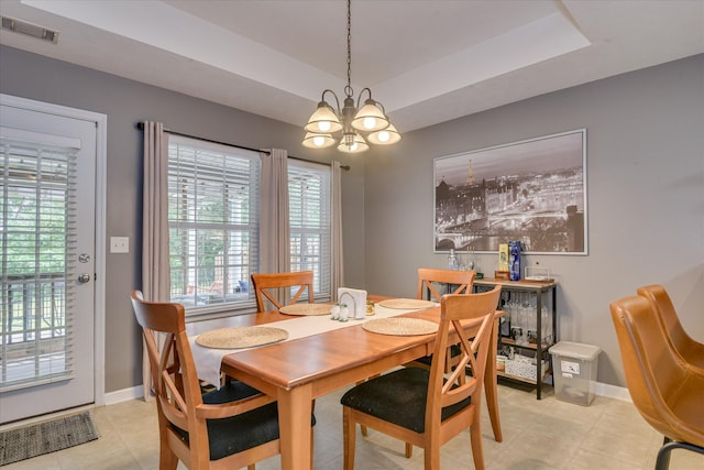 240 Full Circle Dr, Evans, GA 30809 - dining area with a chandelier, healthy amount of natural light, a raised ceiling, and light tile patterned floors