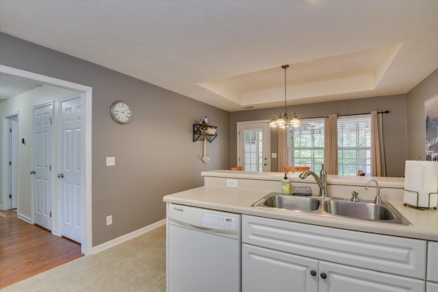 240 Full Circle Dr, Evans, GA 30809 - kitchen with dishwasher, a raised ceiling, white cabinetry, hanging light fixtures, and a chandelier