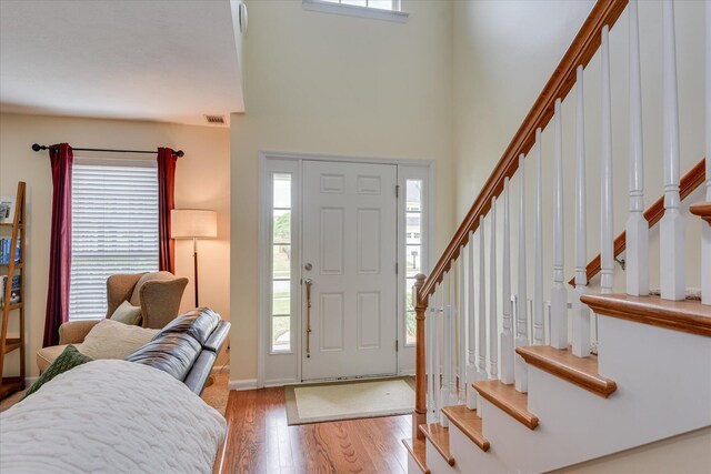 240 Full Circle Dr, Evans, GA 30809 - entrance foyer with wood finished floors, a high ceiling, and stairs