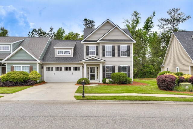240 Full Circle Dr, Evans, GA 30809 - view of front of home with driveway, a shingled roof, a front yard, and a garage