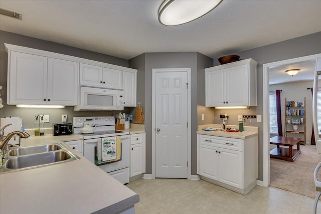 240 Full Circle Dr, Evans, GA 30809 - kitchen with white appliances, white cabinetry, and light countertops