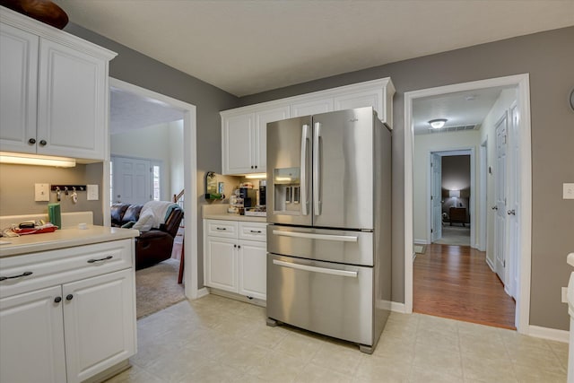 240 Full Circle Dr, Evans, GA 30809 - kitchen featuring stainless steel fridge with ice dispenser, white cabinets, and light countertops