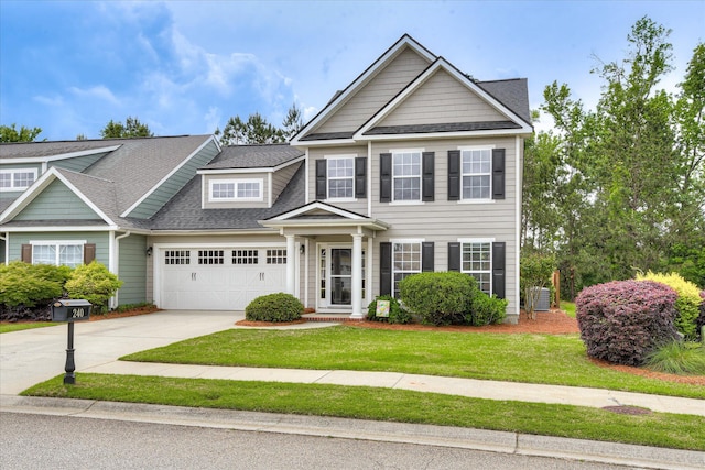 240 Full Circle Dr, Evans, GA 30809 - view of front of home with an attached garage, concrete driveway, a front lawn, and roof with shingles