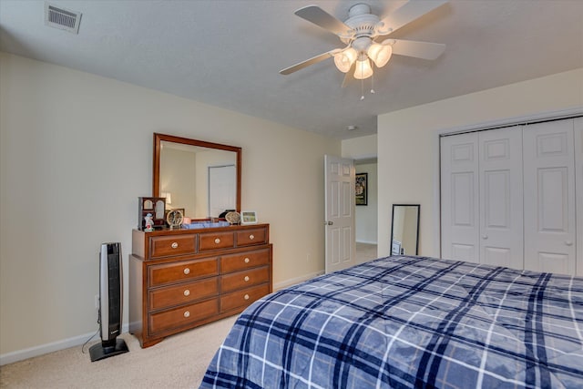 240 Full Circle Dr, Evans, GA 30809 - bedroom with light colored carpet, a closet, and a ceiling fan