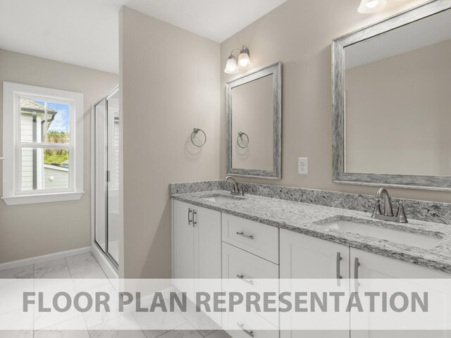 bathroom with double vanity, a stall shower, marble finish floor, and a sink