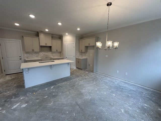 kitchen with recessed lighting, tasteful backsplash, a kitchen island, and crown molding