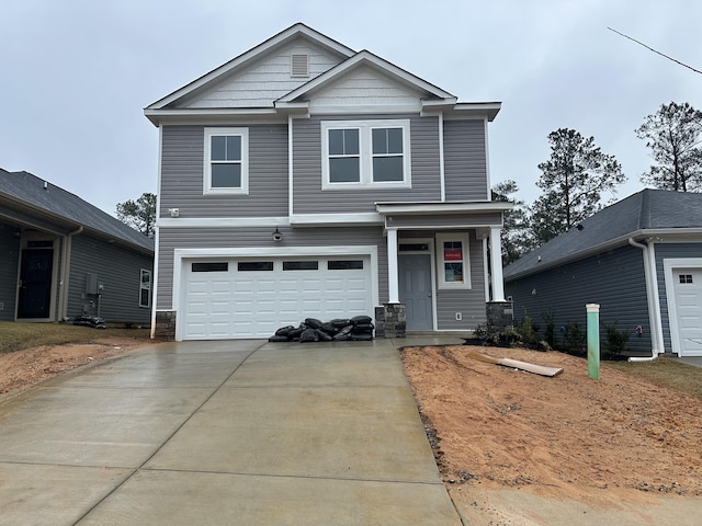 view of front of property with concrete driveway and an attached garage