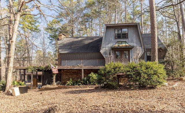 view of front of house featuring a chimney