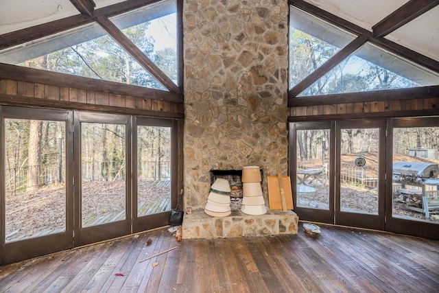 entryway featuring high vaulted ceiling, wood finished floors, and beam ceiling