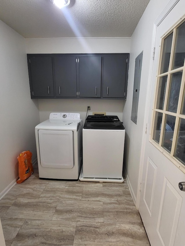 3904 Loblolly Trl, Martinez, GA 30907 - laundry area featuring cabinet space, washer and dryer, electric panel, light wood-style flooring, and a textured ceiling