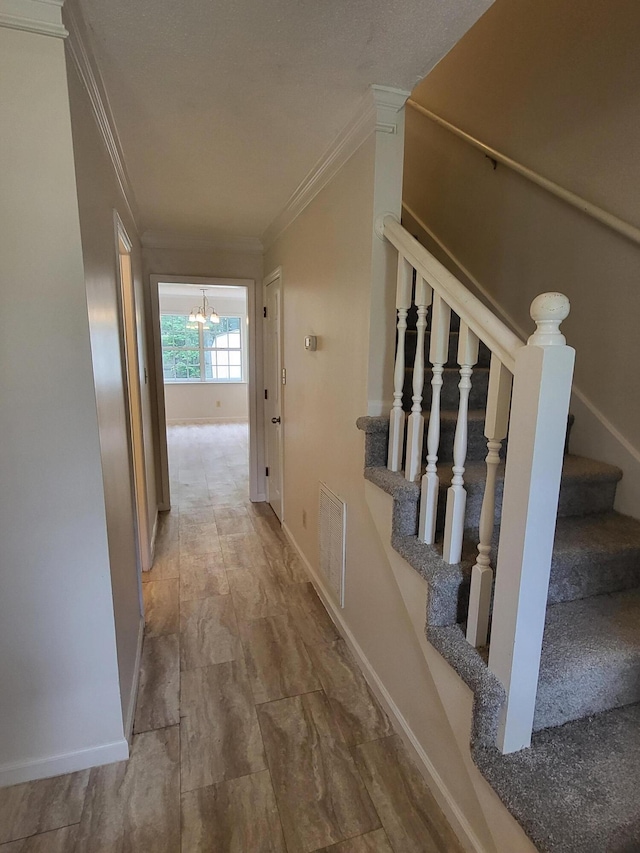 3904 Loblolly Trl, Martinez, GA 30907 - hall with ornamental molding, stairway, and a chandelier