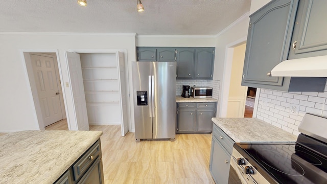 3904 Loblolly Trl, Martinez, GA 30907 - kitchen featuring appliances with stainless steel finishes, crown molding, backsplash, light countertops, and a textured ceiling