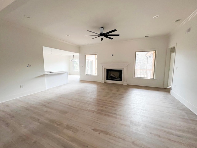 191 Devonshire Dr, Aiken, SC 29803 - unfurnished living room featuring a ceiling fan, light wood-style floors, ornamental molding, a fireplace, and baseboards
