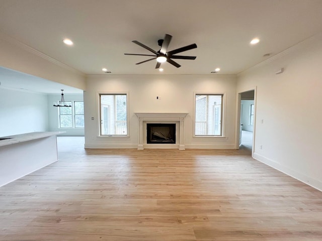 191 Devonshire Dr, Aiken, SC 29803 - unfurnished living room featuring crown molding, a chandelier, a fireplace, recessed lighting, and light wood-type flooring