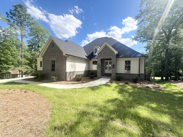 191 Devonshire Dr, Aiken, SC 29803 - view of front of house with brick siding, french doors, a front yard, and a shingled roof