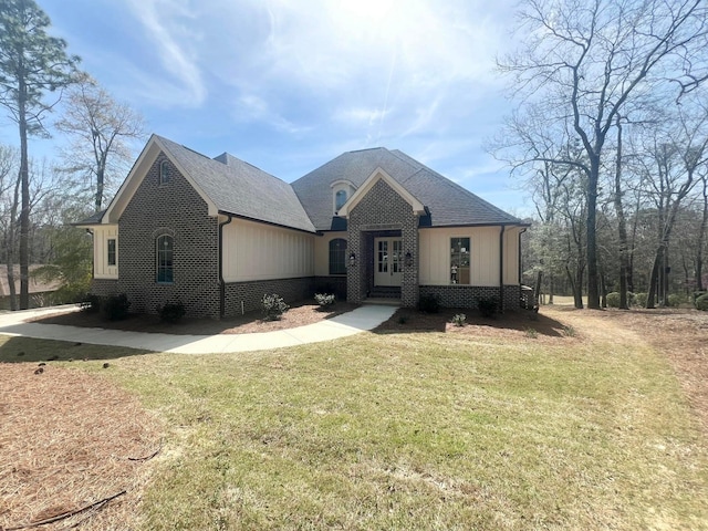 191 Devonshire Dr, Aiken, SC 29803 - french provincial home with a front yard, brick siding, and a shingled roof