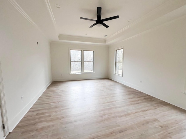 191 Devonshire Dr, Aiken, SC 29803 - empty room featuring a raised ceiling, ornamental molding, a ceiling fan, light wood-style flooring, and baseboards