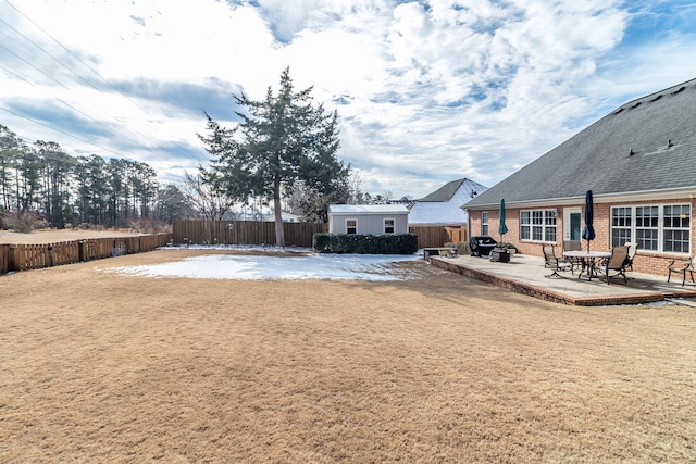 view of yard with an outbuilding and a patio area