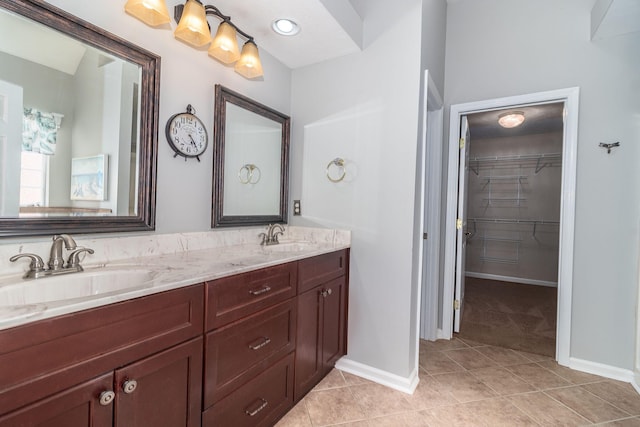 bathroom with tile patterned flooring and vanity