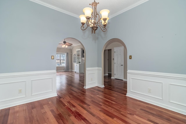 unfurnished dining area with ornamental molding, dark hardwood / wood-style floors, and ceiling fan with notable chandelier