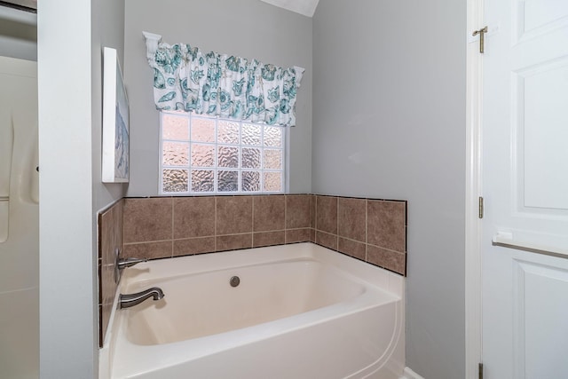 bathroom featuring a tub to relax in