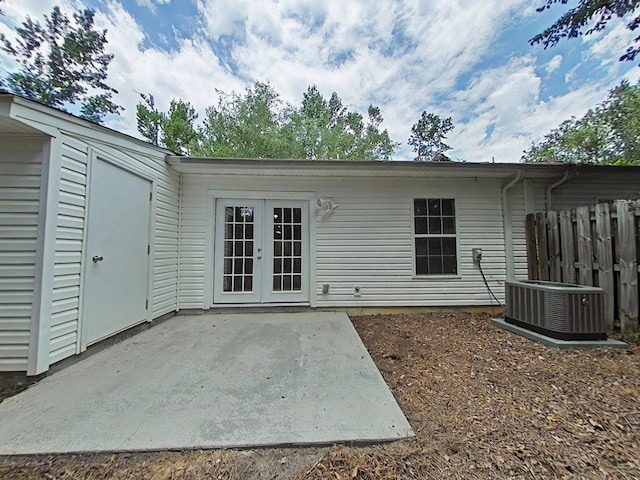 9025 Baker Ct, Augusta, GA 30909 - back of property with central AC, a patio, and french doors