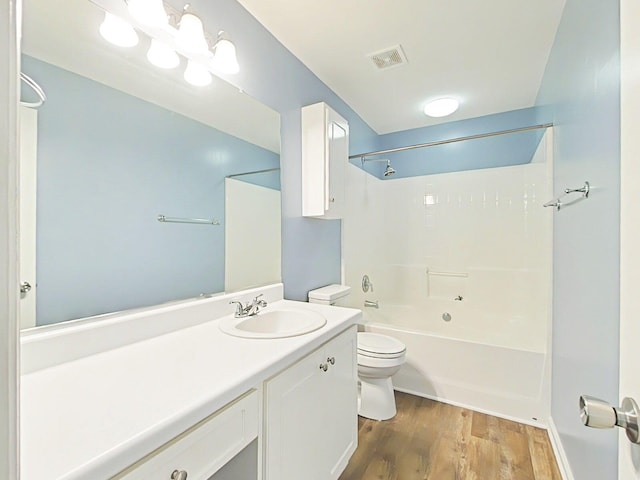 9025 Baker Ct, Augusta, GA 30909 - bathroom featuring toilet, vanity, wood finished floors, and shower / tub combination