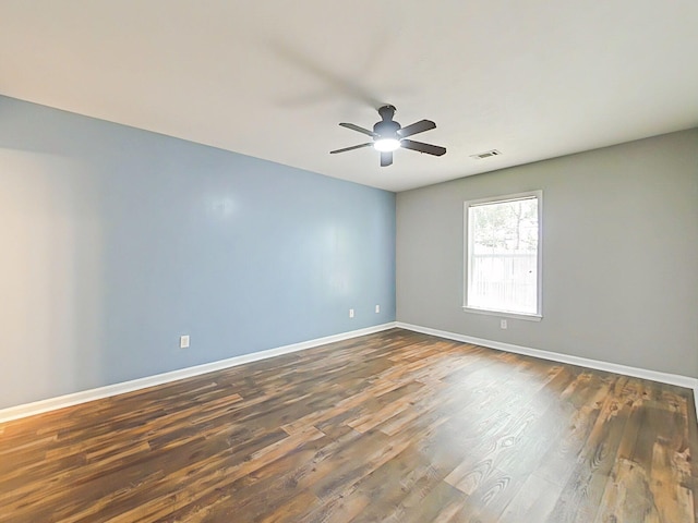 9025 Baker Ct, Augusta, GA 30909 - empty room featuring dark wood finished floors, baseboards, and a ceiling fan