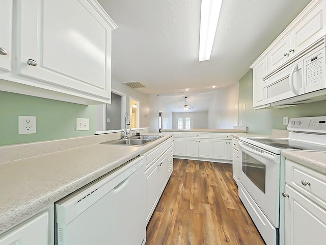 9025 Baker Ct, Augusta, GA 30909 - kitchen featuring white appliances, a sink, a peninsula, and light countertops