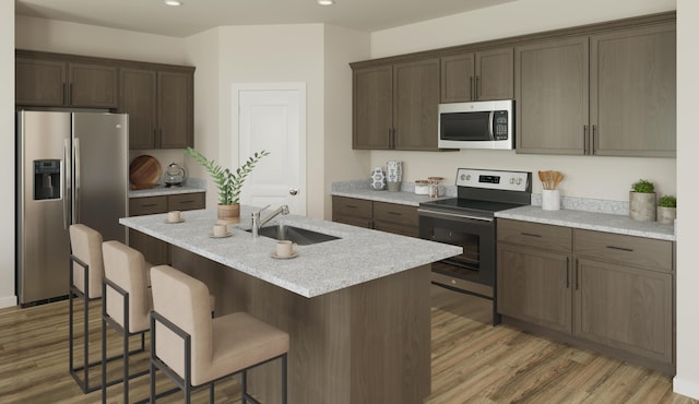790 Count Fleet Ct, Graniteville, SC 29829 - kitchen featuring stainless steel appliances, a sink, recessed lighting, light wood-style floors, and a kitchen bar
