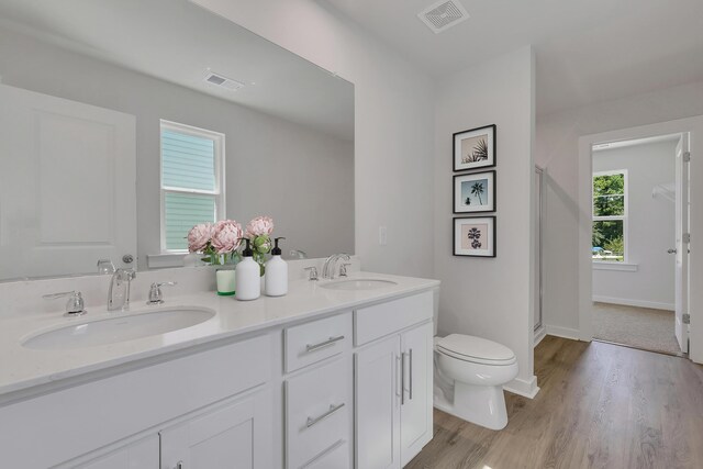 790 Count Fleet Ct, Graniteville, SC 29829 - full bathroom featuring toilet, wood finished floors, double vanity, a shower stall, and baseboards