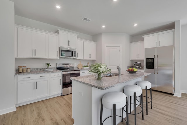 790 Count Fleet Ct, Graniteville, SC 29829 - kitchen featuring stainless steel appliances, a sink, light wood-type flooring, white cabinets, and recessed lighting
