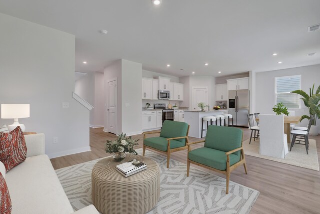 790 Count Fleet Ct, Graniteville, SC 29829 - living area featuring light wood-type flooring, recessed lighting, baseboards, and stairs