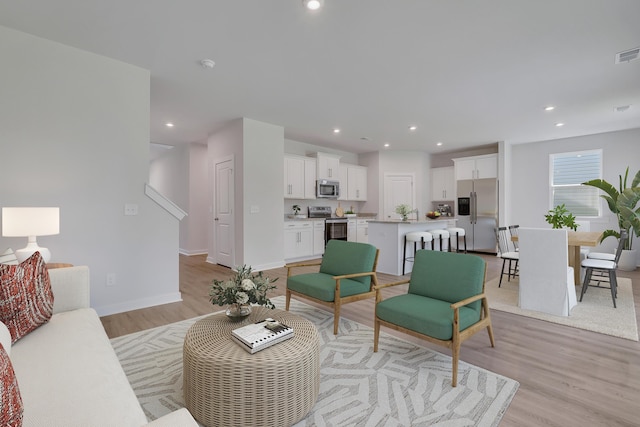 790 Count Fleet Ct, Graniteville, SC 29829 - living area featuring light wood-type flooring, recessed lighting, baseboards, and stairs