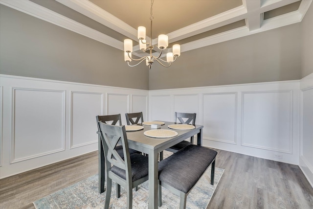 736 Courtland Ln, Harlem, GA 30814 - dining area with crown molding, an inviting chandelier, and a decorative wall