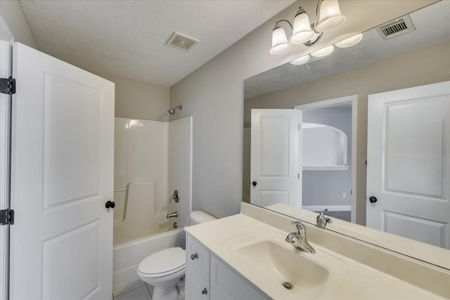 bathroom with visible vents, toilet, vanity, and a textured ceiling